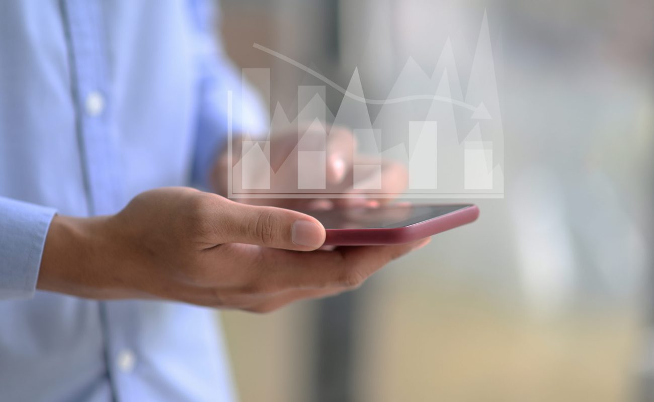 Close-up shot of A businessman using a smartphone.